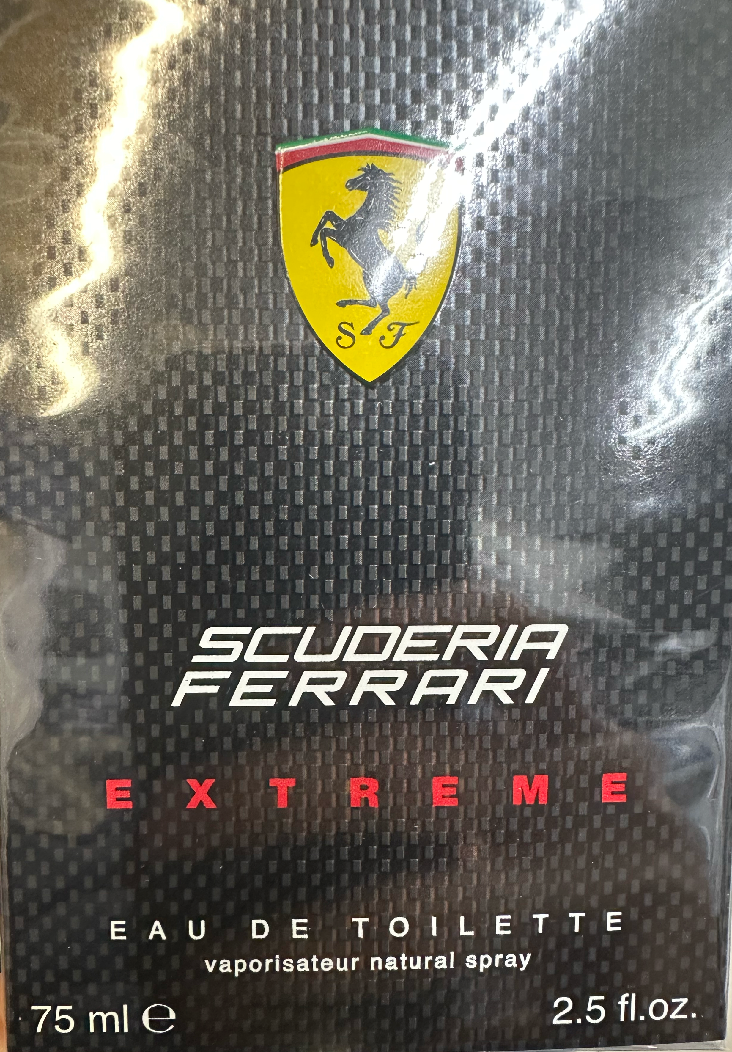 Box of Ferrari Scuderia Extreme 75ml Eau De Toilette, capturing a masculine adventure scent with the iconic logo.