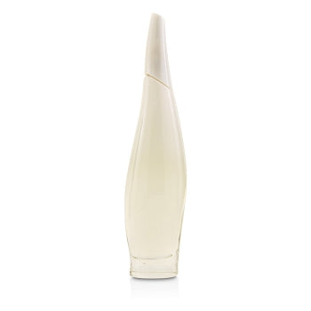 A sophisticated, curved, tall perfume bottle contains DKNY's Donna Karan Liquid Cashmere White 100ml Eau De Parfum, renowned for its light-colored liquid and enchanting floral aroma.