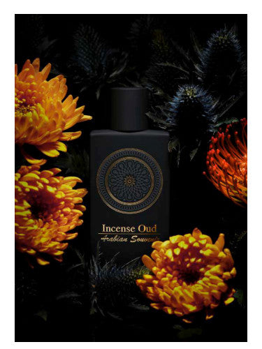 A bottle of AL Musbah Incense Oud 90ml Eau De Parfum surrounded by vibrant orange flowers and dark foliage on a black background, by Rio Perfumes.