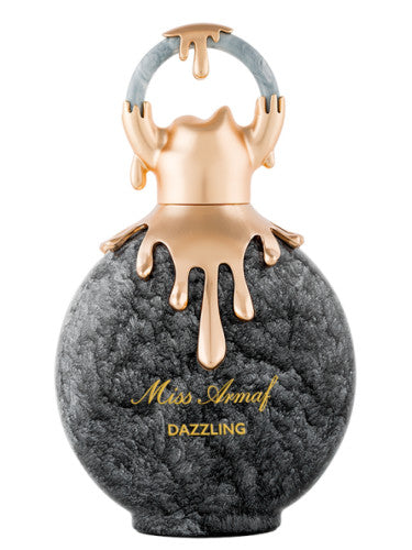 Miss Armaf Dazzling 100ml Eau De Parfum by Armaf is a captivating women's fragrance. The round bottle features a marbled gray texture with gold accents, and the top and handle are adorned with an elegant gold drip design.