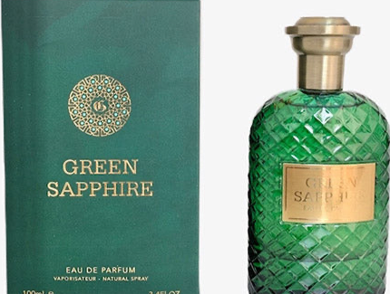 A green perfume bottle labeled "Fragrance World Green Sapphire 100ml Eau De Parfum" next to its matching box. The box and bottle feature a gold emblem and text. The bottle has a diamond-patterned surface and a gold-colored cap, containing Oriental scents crafted as a fragrance for men & women.