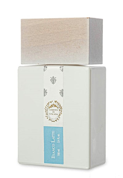 A rectangular bottle of Giardini di Toscana Bianco Latte Eau De Parfum with a wooden cap and a white label featuring a crest logo and blue accent. It exudes an Amber Vanilla fragrance, offering a hint of caramel in its luxurious scent.