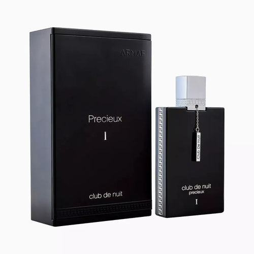 The Armaf Club de Nuit Precieux Extrait De Parfum from the brand Armaf showcases elegance with its black bottle and box enhanced by silver accents and a stylish silver cap adorned with a chain. This Eau De Parfum embodies the essence of an Oriental Woody fragrance, providing a luxurious scent experience.