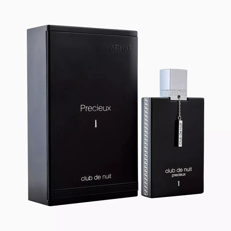 Load image into Gallery viewer, The Armaf Club de Nuit Precieux Extrait De Parfum from the brand Armaf showcases elegance with its black bottle and box enhanced by silver accents and a stylish silver cap adorned with a chain. This Eau De Parfum embodies the essence of an Oriental Woody fragrance, providing a luxurious scent experience.
