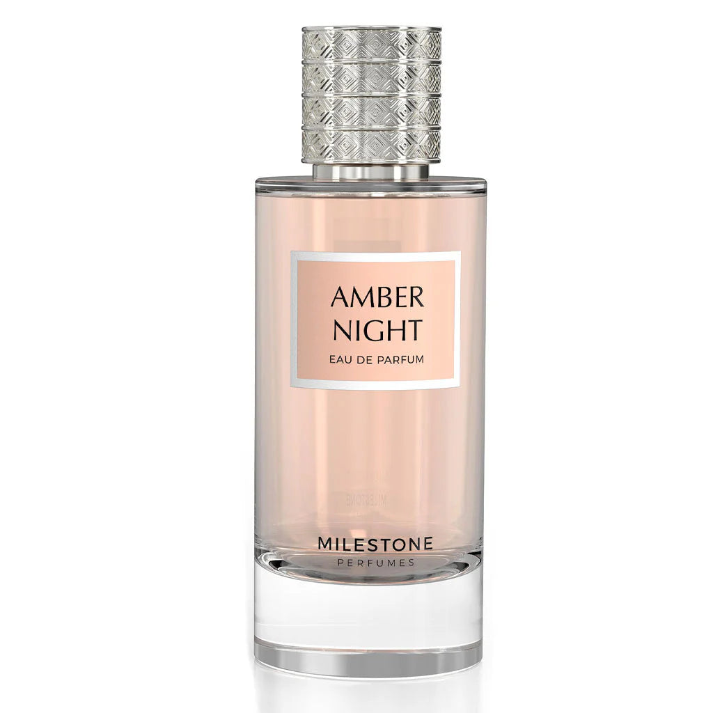 A bottle of Milestone Amber Night 85ml Eau De Parfum by Rio Perfumes, characterized by its clear glass design and a textured silver cap, exudes an enchanting Vanilla Rose aroma.