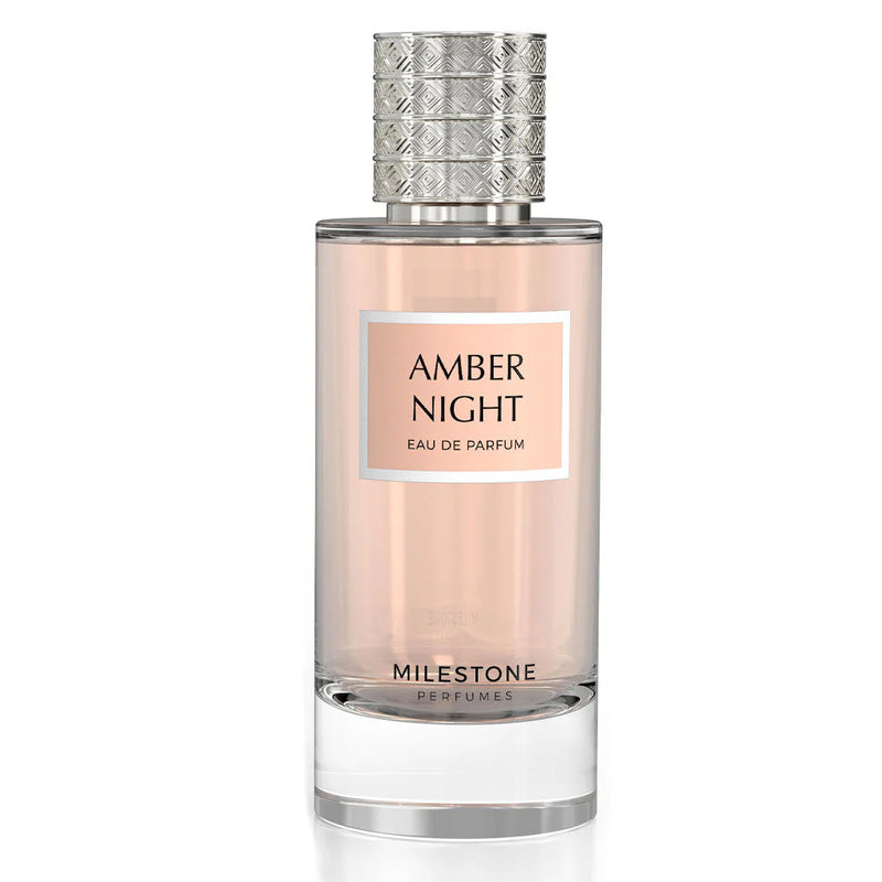 Load image into Gallery viewer, A bottle of Milestone Amber Night 85ml Eau De Parfum by Rio Perfumes, characterized by its clear glass design and a textured silver cap, exudes an enchanting Vanilla Rose aroma.
