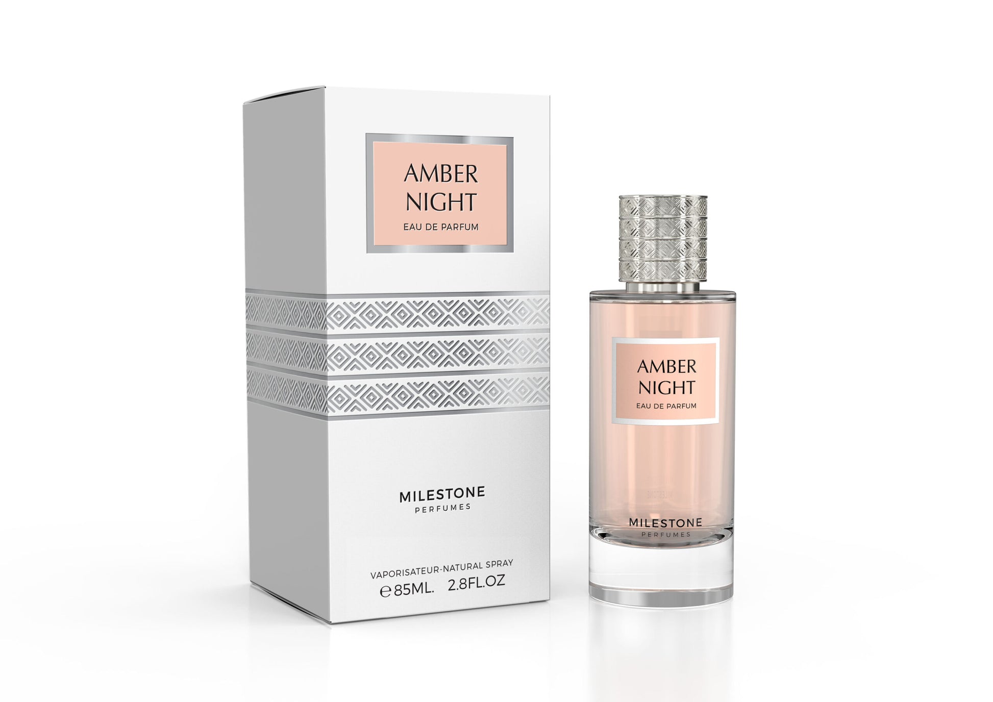 A perfume bottle labeled "Milestone Amber Night 85ml Eau De Parfum" gracefully stands beside its matching box, adorned with a geometric pattern and the elegant words "Rio Perfumes." The captivating scent of Vanilla Rose dances in the air, promising a truly enchanting fragrance experience.