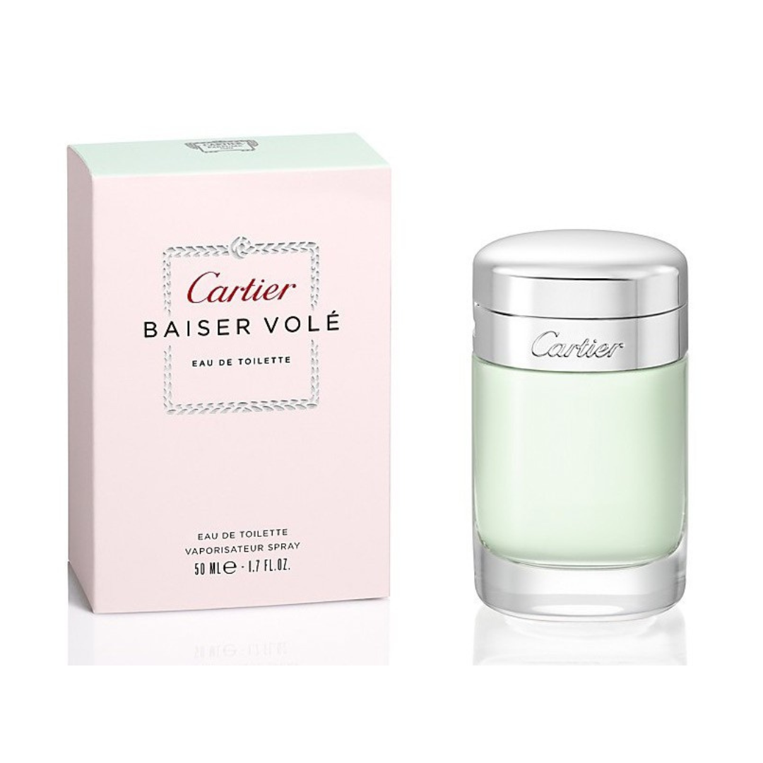 The Cartier Baiser Vole 100ml EDT bottle and box exude elegance. A pale pink box with black text complements the clear bottle topped with a metallic cap, housing a floral fragrance inspired by enchanting lilies.