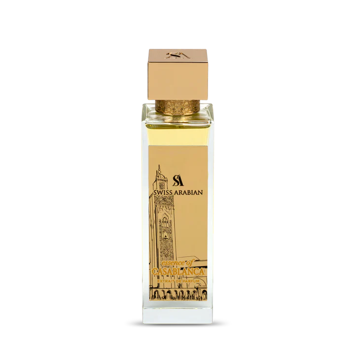 The Swiss Arabian Essence Of Casablanca 100ml Extrait De Parfum is a captivating unisex fragrance in a rectangular bottle with a gold cap, featuring an illustrated tower and labeled "Swiss Arabian" and "Spirit of Casablanca.