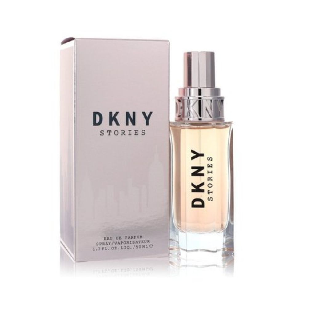 The DKNY Stories 50ml Eau De Parfum by DKNY features a sleek, modern design with a metallic cap, complemented by its soft pink packaging box.