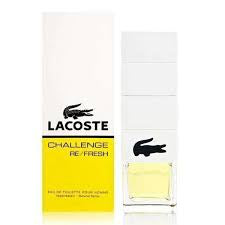 A bottle and box of Lacoste Challenge Refresh eau de toilette by Lacoste. The box is white and yellow, and the bottle is clear with a white lid featuring the Lacoste logo. This aromatic spicy fragrance for men exudes confidence and vitality.