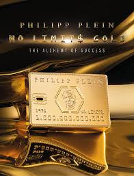 Gold bar inscribed with "Philipp Plein No Limit$ Gold The Alchemy of Success" and an image of a credit card on its surface, encapsulating the essence of Philipp Plein No Limits Gold 90ml Eau de Parfum by Philip Plein, a luxurious fragrance for men & women.