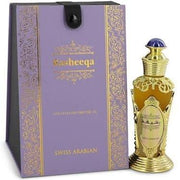 A bottle of Swiss Arabian Rasheeqa 20ml Concentrated Perfume Oil, known for its floral fragrance, boasts ornate gold detailing and comes with luxurious purple and gold packaging.