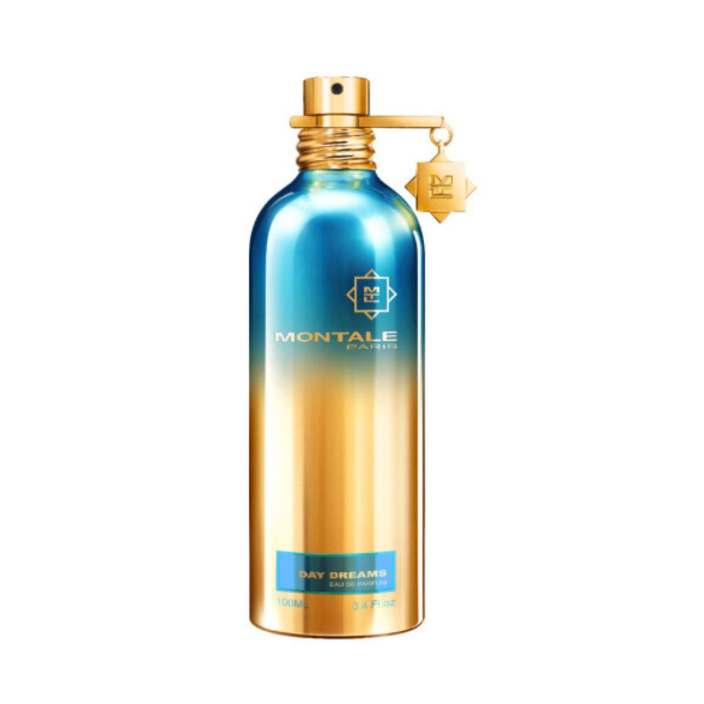 The Montale Paris Day Dreams 100ml is a captivating unisex fragrance with floral, fruity, and gourmand notes, housed in a metallic blue and gold bottle adorned with a star-shaped charm.