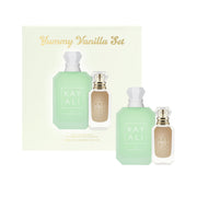 Discover the Kayali Yummy Vanilla 50ml Eau De Parfum Set, a gourmand delight with two elegant white-capped bottles in different sizes.