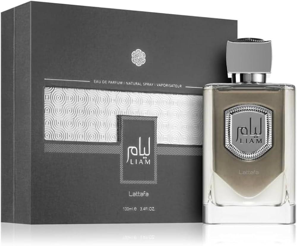 A bottle of Lattafa Liam 100ml Eau De Parfum by Rio Perfumes, a captivating unisex fragrance, is displayed next to its matching box. The bottle features a silver cap and a label with the name "Liam," while the box is adorned with elegant textual and geometric design elements.