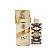 Gold cylindrical container and matching bottle of Lattafa Oud Mood 100ml Eau de Parfum, a captivating men's fragrance with black decorative patterns.