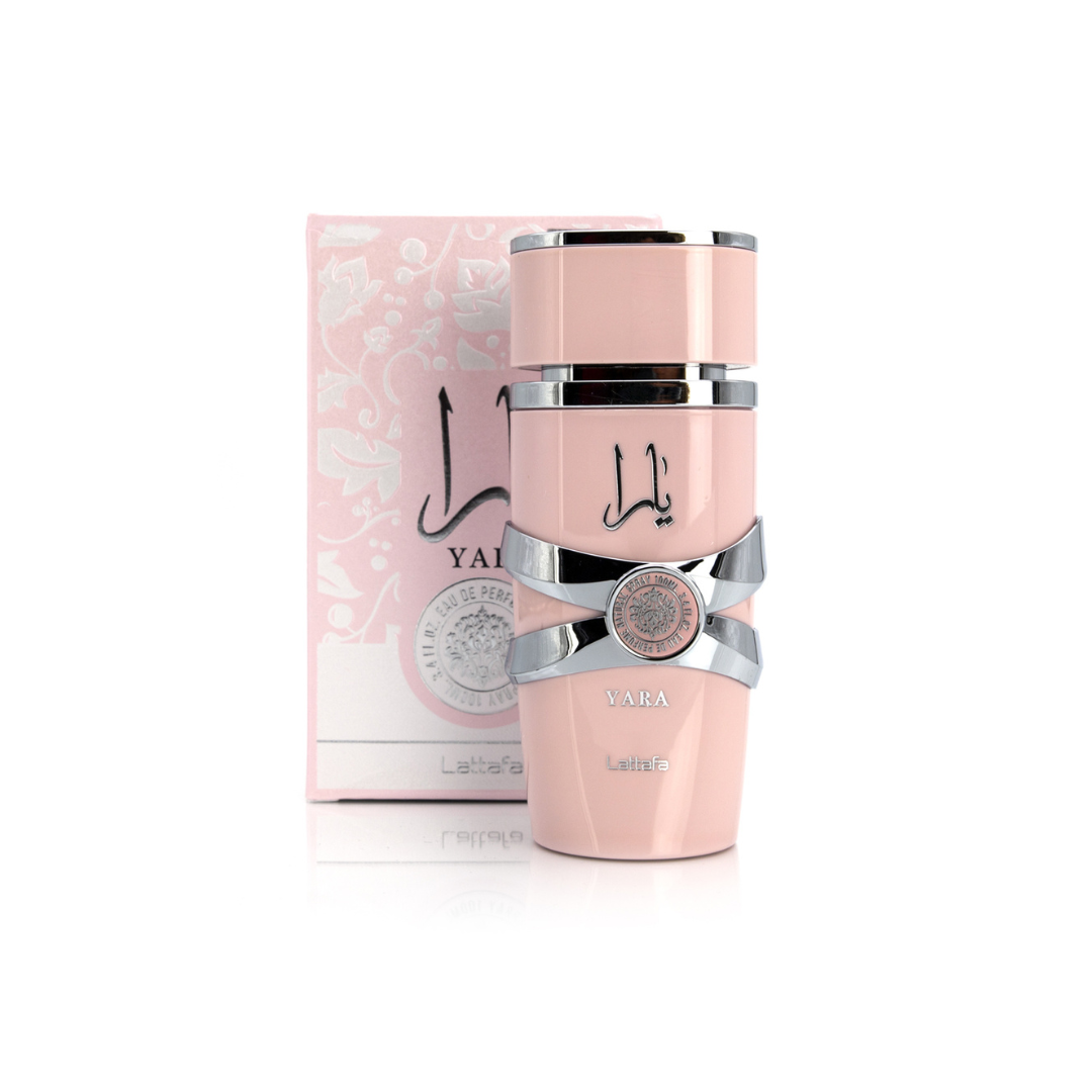 The Lattafa Yara 100ml Eau de Parfum, in a pink bottle with silver accents, sits beautifully before its matching floral box. This sophisticated fragrance is available as a Buy 1 Get 1 Free deal.