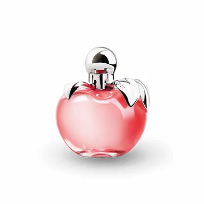 The Nina Ricci Les Belles De Nina 80ml Eau De Toilette enchants with its pink, apple-shaped bottle featuring a silver cap and graceful leaf details, capturing the distinctive allure of Nina Ricci.