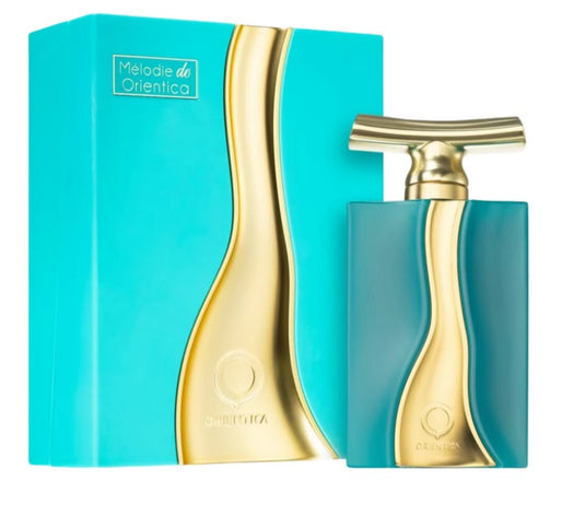 A turquoise and gold perfume bottle and its matching box, labeled 