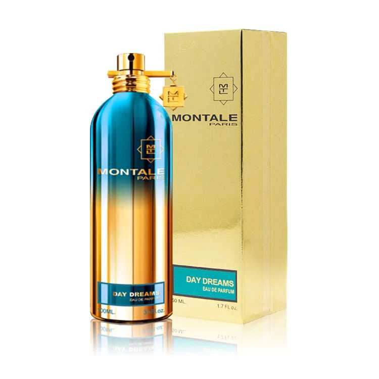 The Montale Paris Day Dreams 100ml perfume showcases a captivating blue to gold gradient bottle with a matching golden box. This Floral Fruity Gourmand unisex fragrance enchants all who experience it.