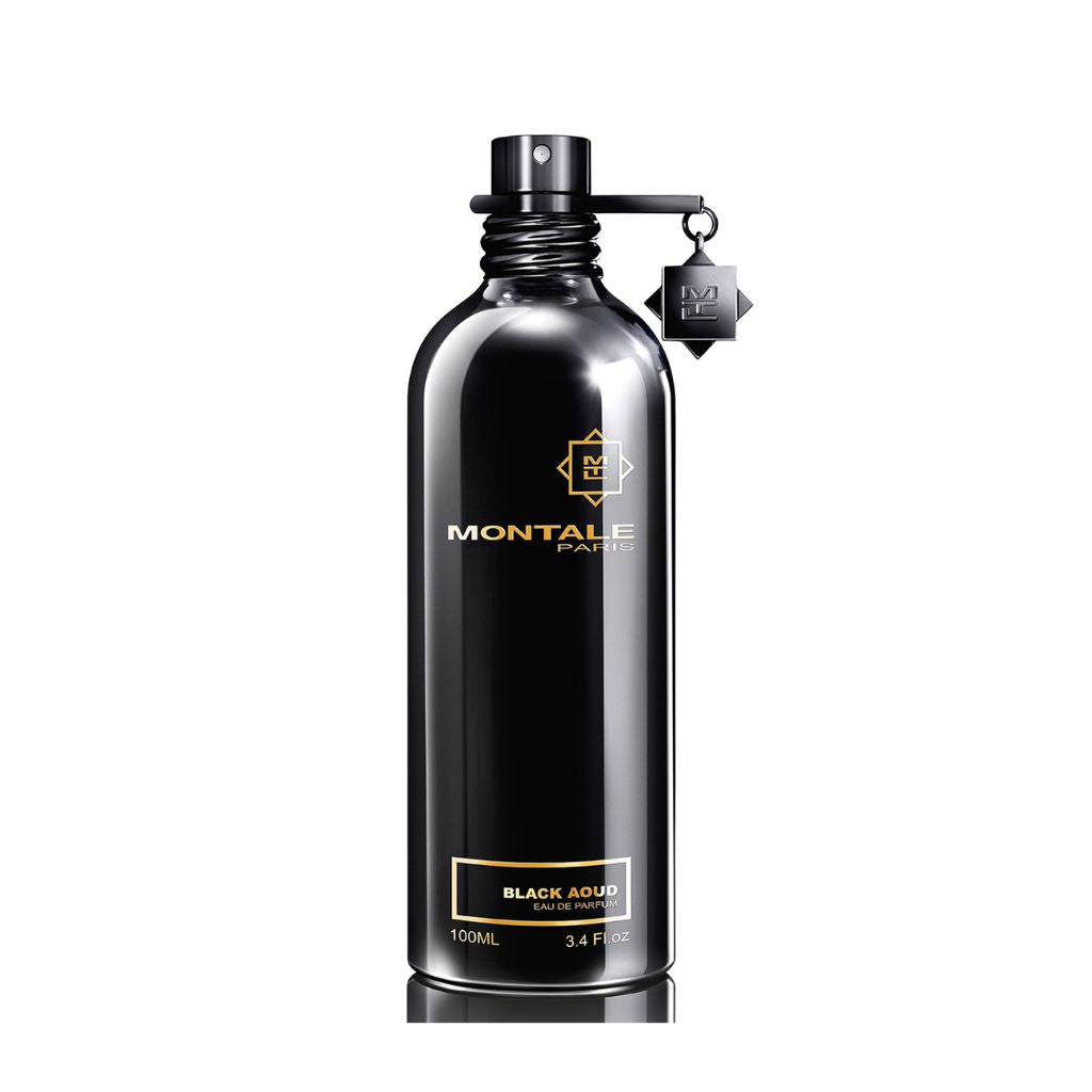 A Montale Paris Black Aoud 100ml Eau De Parfum in a black metallic bottle, with the iconic brand logo and a decorative charm on the cap.