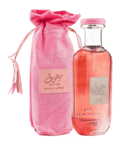 A bottle of Ard Al Zaafaran Mousuf Wardi 100ml Eau De Parfum with a matching pink drawstring bag.