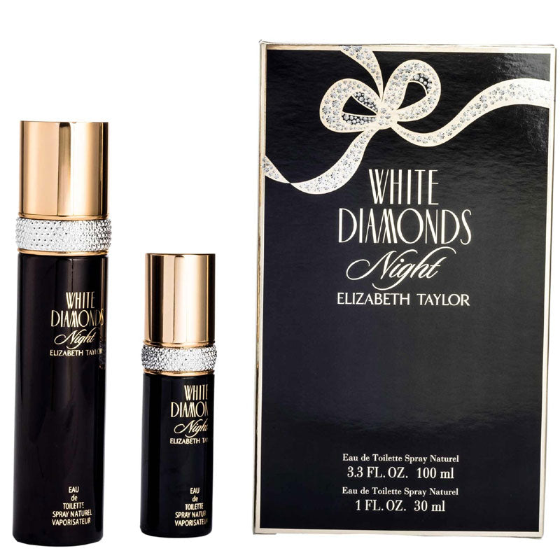 Two Elizabeth Taylor "White Diamonds Night" bottles in black and gold are displayed next to a matching box that reads “Eau de Parfum 100ml” and “Eau de Toilette 30ml,” showcasing the exquisite Floral Woody Musk fragrance for women.