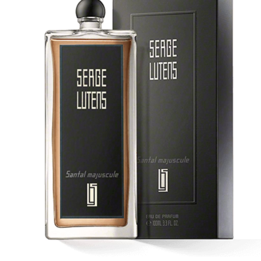 The Serge Lutens Santal Majuscule 100ml Eau De Parfum comes in a sophisticated bottle and box, featuring fragrance notes of cocoa and sandalwood.