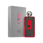 The Afnan 9 pm Rebel 100ml Eau De Parfum bottle features a silver cap and bold red accents, offering an aromatic fruity fragrance ideal for all genders.