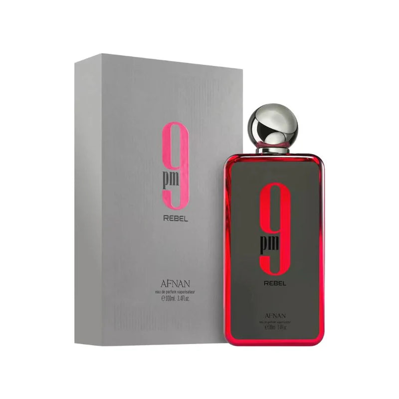 The Afnan 9 pm Rebel 100ml Eau De Parfum bottle features a silver cap and bold red accents, offering an aromatic fruity fragrance ideal for all genders.