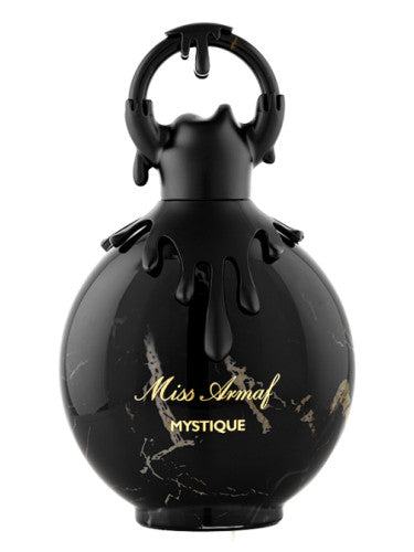 The Miss Armaf Mystique 100ml Eau De Parfum features a round black bottle with a decorative cap, offering an exquisite women's fragrance by Armaf.