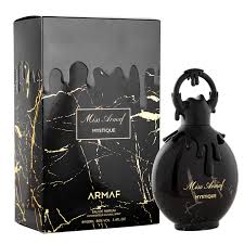 Load image into Gallery viewer, The black perfume bottle, labeled &quot;Miss Armaf Mystique 100ml Eau De Parfum&quot; by Armaf, exudes elegance alongside its black and gold marbled box, embodying a captivating fragrance that defines a signature scent for women.
