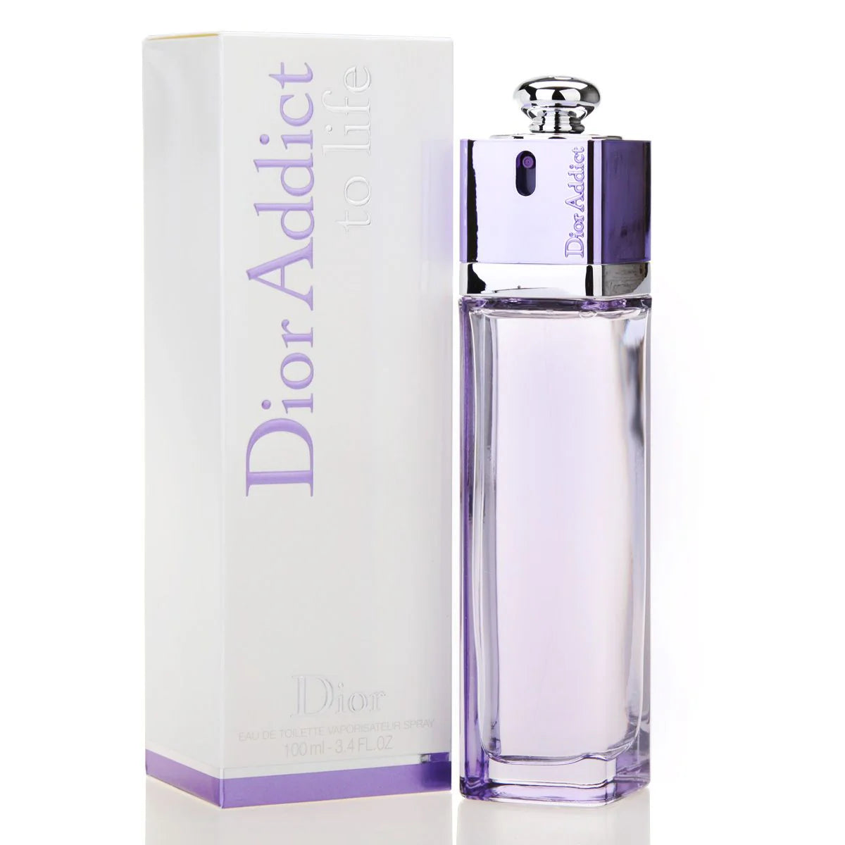 A clear, rectangular perfume bottle with a purple tint is elegantly placed next to a white box featuring the label "Dior Addict to Life 100ml Eau De Toilette," embodying the essence of this fragrance by Dior.