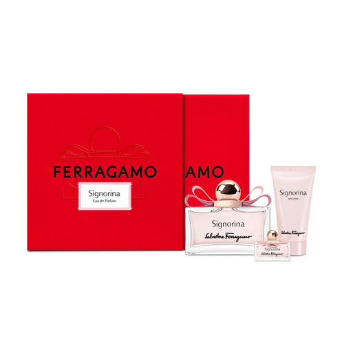 The Salvatore Ferragamo Signorina 100ml Eau De Parfum Gift Set includes a red box with a floral fruity fragrance bottle, plus a vial and body lotion tube.