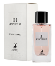 A bottle of "Maison Alhambra L’Impressio III Pour Femme 100ml Eau De Parfum" by Alhambra next to its packaging box, both featuring a deer logo.