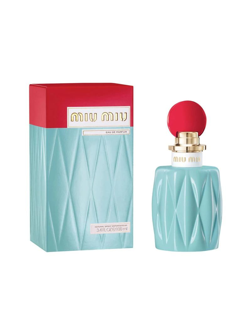 Image of MIU MIU miniature 7ml Eau De Parfum mini. The bottle, embodying a floral fragrance, is light blue with a red circular cap and gold accents. The packaging box mirrors this with its light blue and red top, proudly displaying the brand name "MIU MIU" in gold.