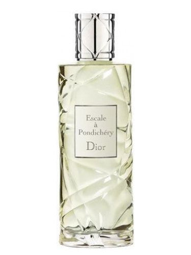 The Dior Escale a Pondichery 125ml EDT perfume, renowned for its black tea accords, showcases a faceted, transparent bottle design accented with a silver cap. The label gracefully highlights the Dior brand and fragrance name, making it an enchanting scent for women.