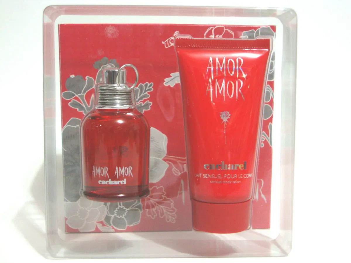 A bottle of Cacharel Amor Amor perfume, specifically the Cacharel Amor Amor 100ml Eau De Toilette Set, and a tube of cream.