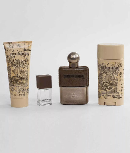 The True Religion Fragrances Fashion For The Senses 4 Pc 100ml Eau De Toilette Gift Set includes four uniquely packaged grooming products: a tube, a small bottle, a larger bottle with a round cap, and a cylindrical stick—all adorned with detailed vintage-style labels. Each item exudes the aromatic fougere signature that defines True Religion's fragrances.