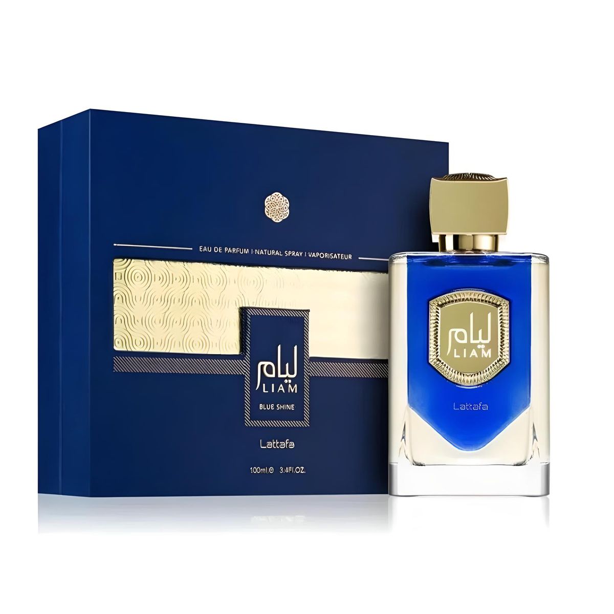 A 100ml bottle of Lattafa Liam Blue Shine Eau de Parfum by Rio Perfumes is displayed next to its matching dark blue and gold box. The rectangular perfume bottle contains a blue liquid and features a gold cap, offering a captivating fragrance for both men and women.