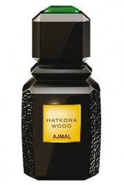 A bottle of Ajmal Hatkora Wood 100ml Eau De Parfum by Ajmal on a white background, available at Rio Perfumes.