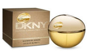 The DKNY Golden Delicious 100ml EDP boasts a gold and clear spherical bottle accented with a chic gold label. This women's fragrance embodies sophistication by effortlessly merging luxury with allure.