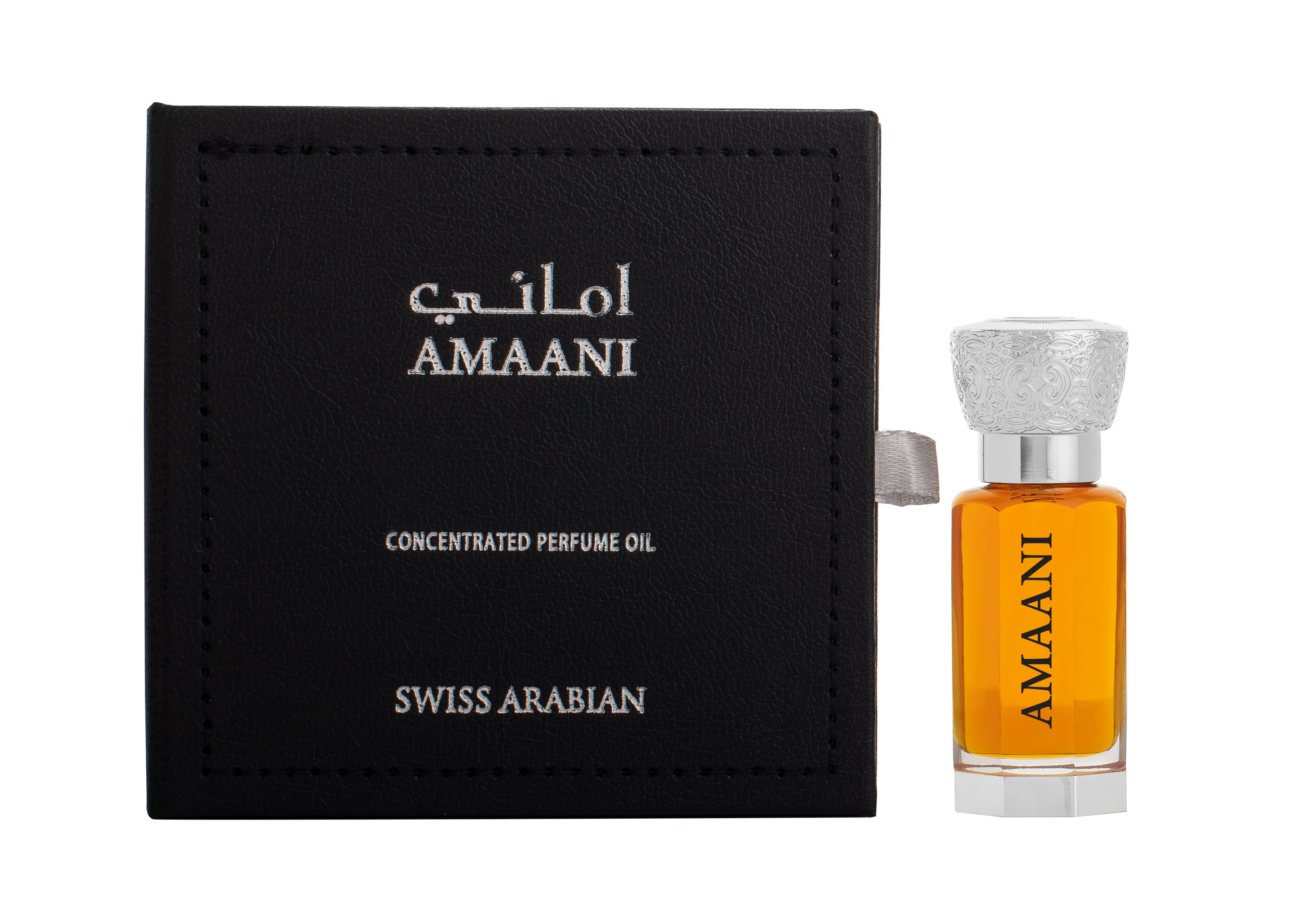 A small bottle of Swiss Arabian Amaani Concentrated Perfume Oil is set beside its black packaging box adorned with silver text. The 12ml EDP bottle contains amber-colored liquid and has an ornate silver cap, perfectly capturing the essence of a luxurious unisex fragrance.