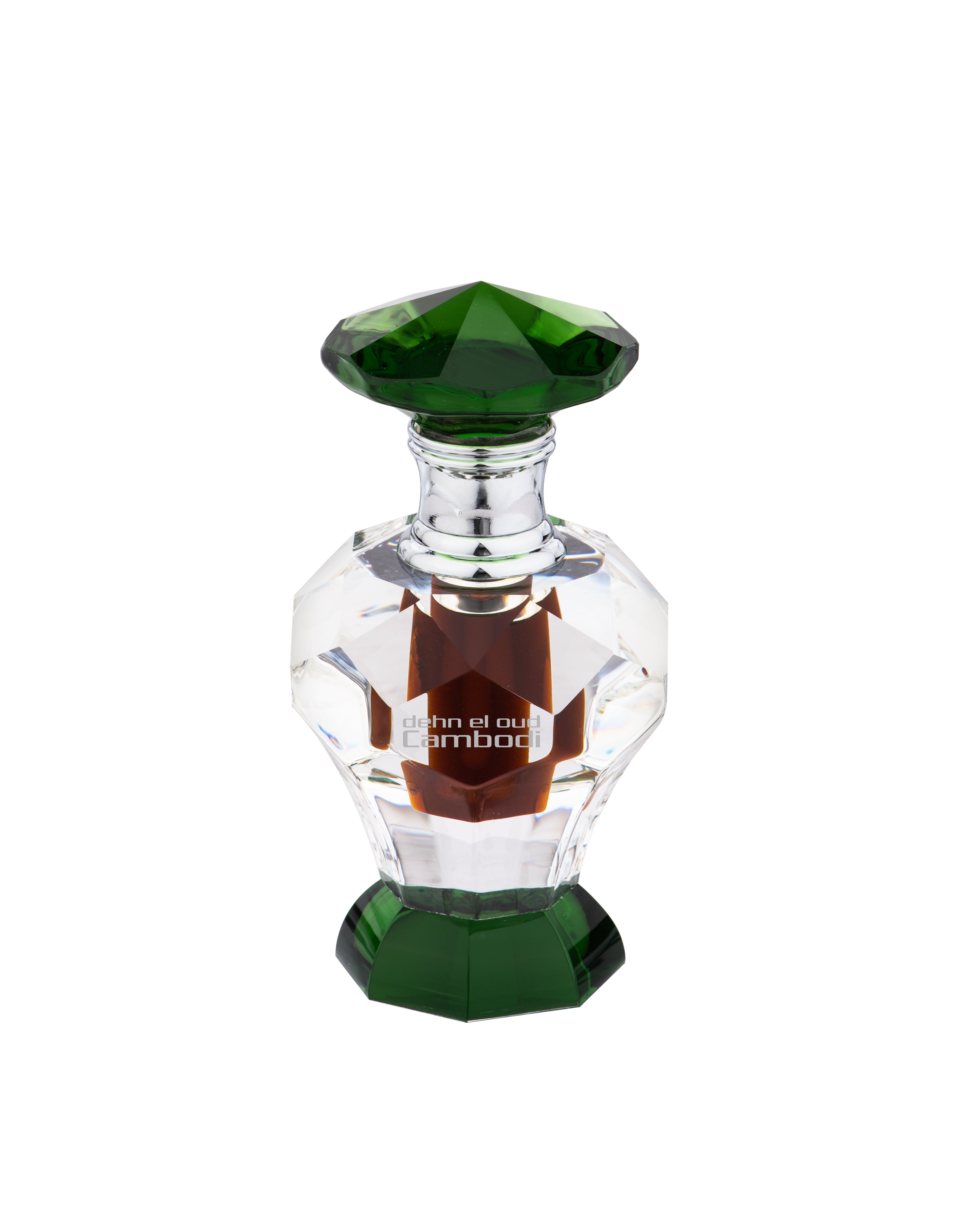 Clear glass perfume bottle with green accents, containing dark amber liquid, labeled "Swiss Arabian Dehn El Oud Cambodi concentrated perfume oil," housed in a luxury crystal bottle.