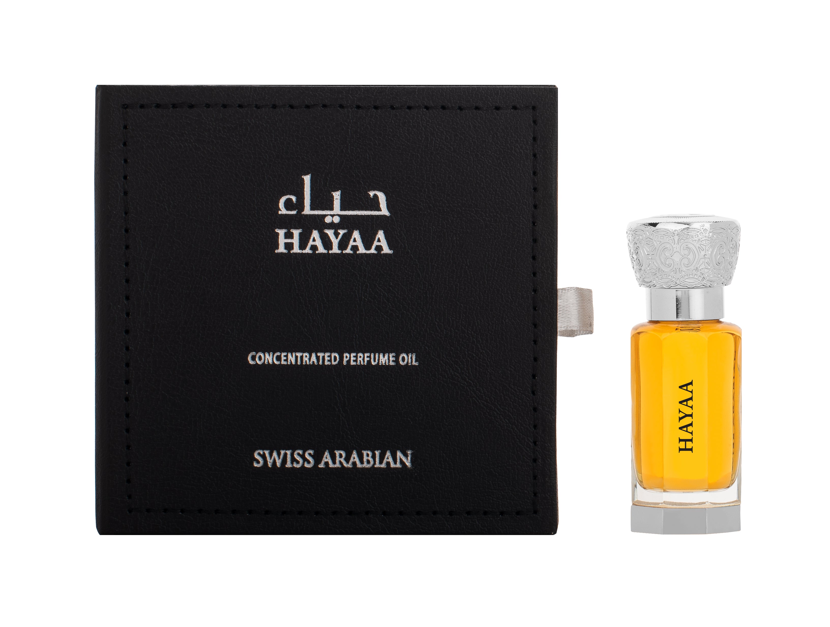 A bottle of Swiss Arabian Hayaa concentrated perfume oil, known for its unisex fragrance imbued with white amber, is next to its black rectangular box.