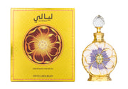 A yellow box with a floral design labeled "Swiss Arabian Layali Concentrated Perfume Oil" sits beside an ornate perfume bottle featuring a flower pattern and a crystal-like cap, exuding an amber floral fragrance. Text at the bottom reads "Swiss Arabian.