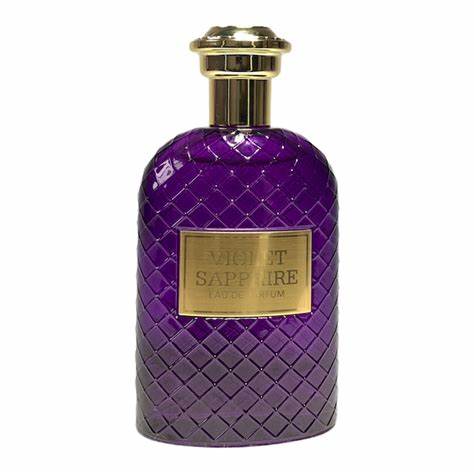 The Fragrance World Violet Sapphire Eau de Parfum features an elegant purple and gold bottle with a diamond-patterned surface and sleek gold cap. This unisex fragrance exudes luxury and sophistication in each drop, with a special buy one get one free offer.