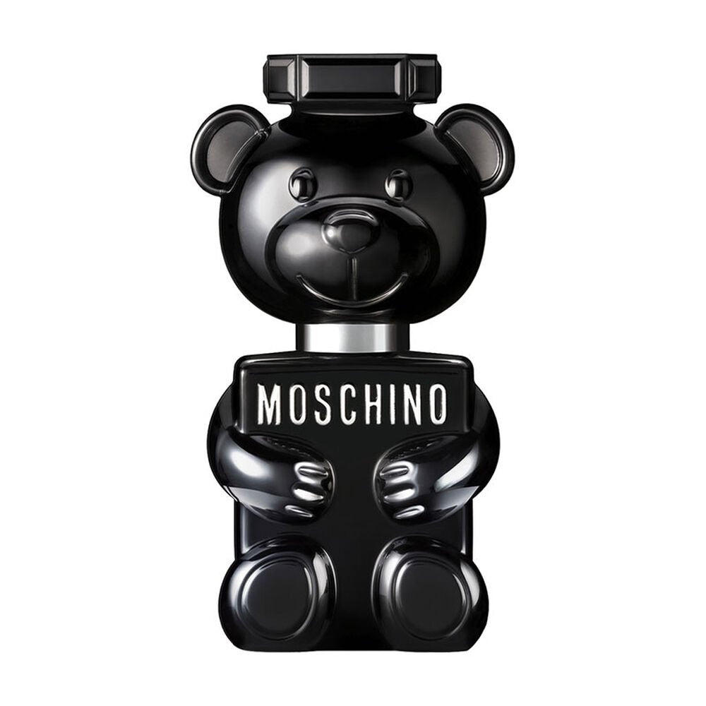 Introducing the Moschino Toy Boy 100ml Eau De Parfum: a black teddy bear-shaped perfume bottle proudly adorned with "Moschino" across its chest. This woody spicy fragrance for men seamlessly combines playful charm and sophistication, capturing the captivating allure of Moschino.