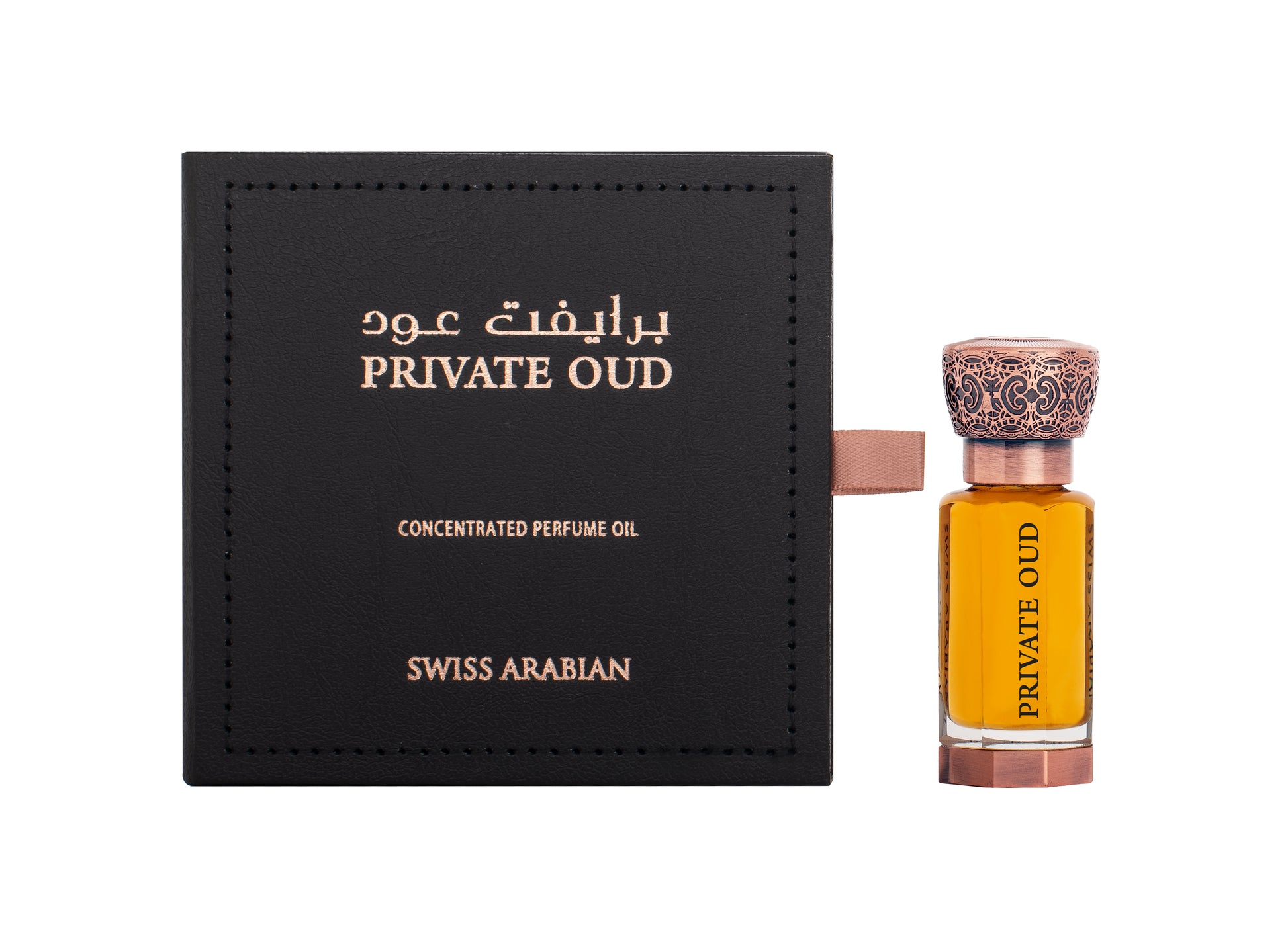 A black box labeled "Swiss Arabian Private Oud Concentrated Perfume Oil, Swiss Arabian" stands beside a small ornate bottle filled with amber-colored liquid, also labeled "Swiss Arabian Private Oud Concentrated Perfume Oil," making it a perfect fragrance for men and women.